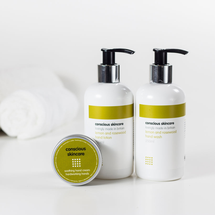 Organic handwash and hand cream set in silver tin and two white glass bottles