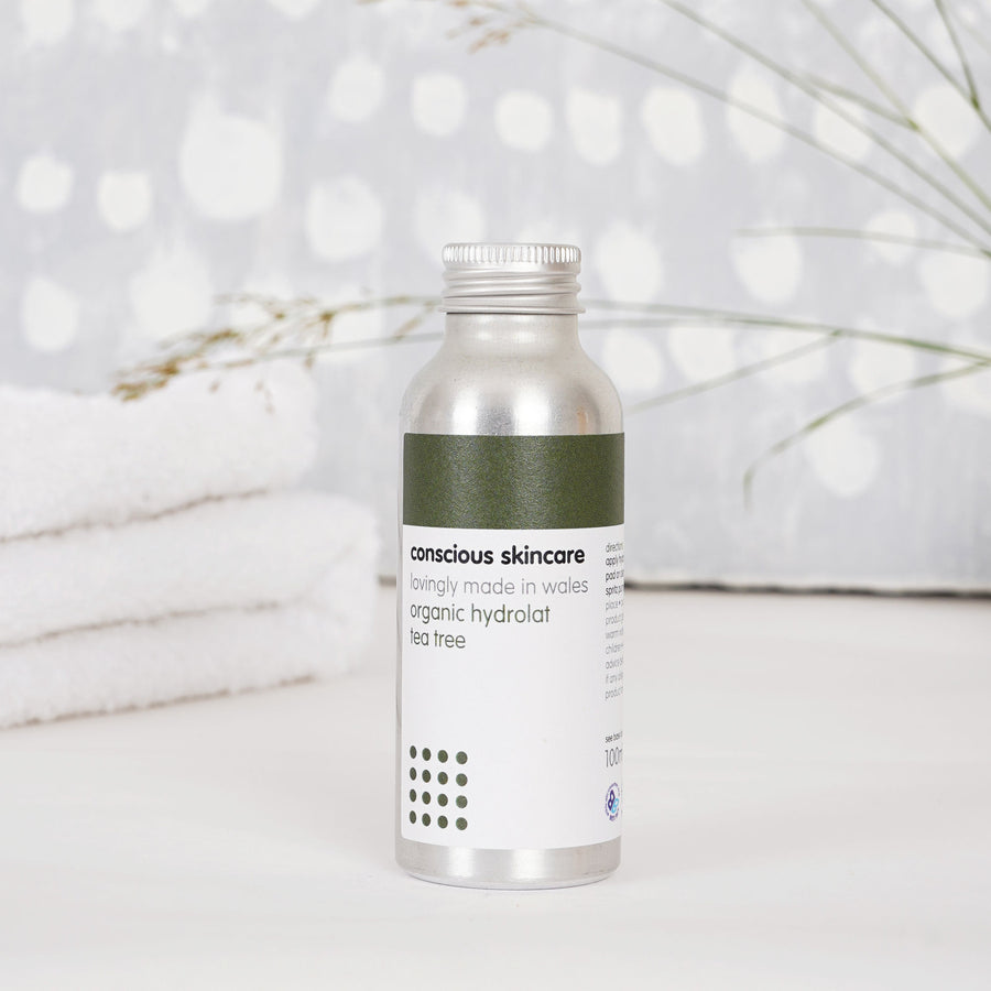 Organic Tea Tree Toner - 100% Pure Floral Water - in silver bottle with towels in background