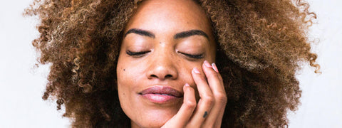 Womans face using Conscious Skincare Conscious skincare natural moisturisers range 