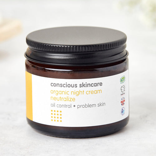 neutralize night face cream for oily skin in amber glass jar with black metal lid