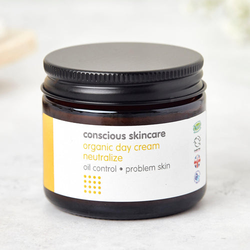 organic cream for oily & problem skin in amber glass jar with black metal lid