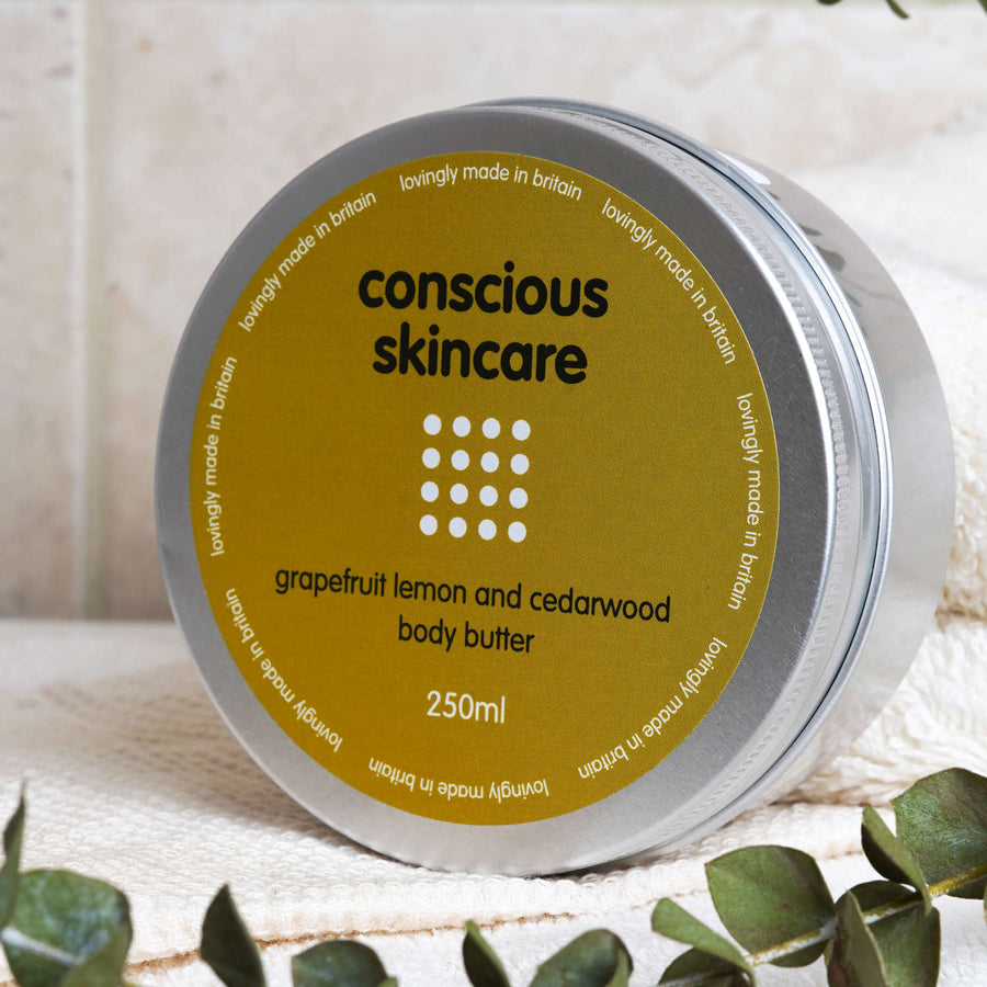 Grapefruit body butter packshot at an angle - lifestyle 
