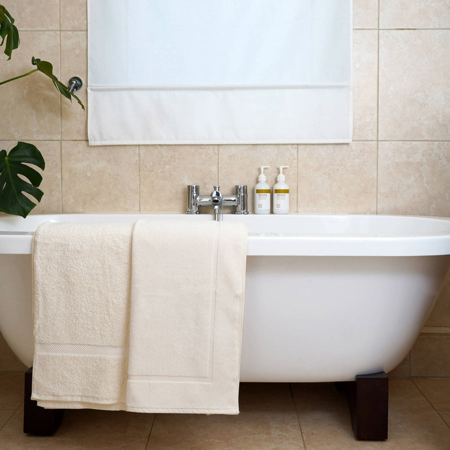 organic bath towel and natural bath mat in unbleached organic cotton