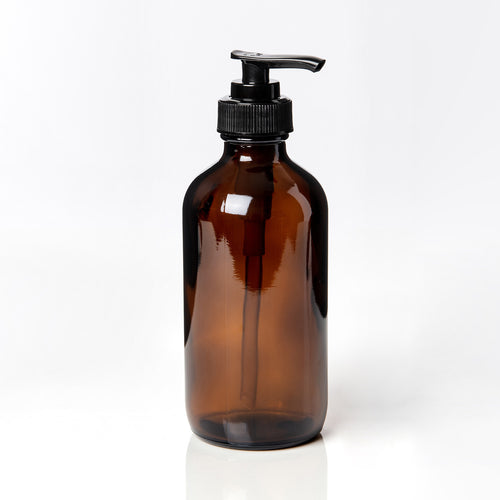 Amber glass bottle with black dispenser pump