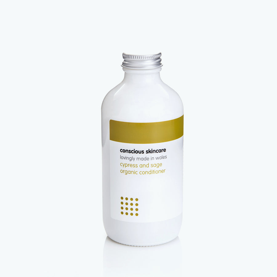 Cypress and Sage Vegan Hair Conditioner in a white glass bottle with silver cap