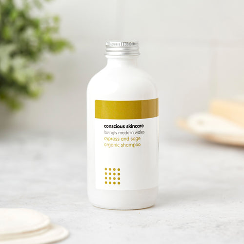cypress and sage paraben free shampoo in white glass bottle with silver screw cap