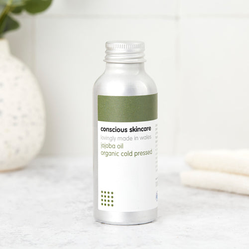 organic cold-pressed jojoba oil for skin in a 100ml aluminium bottle; lightweight face, body & hair oil