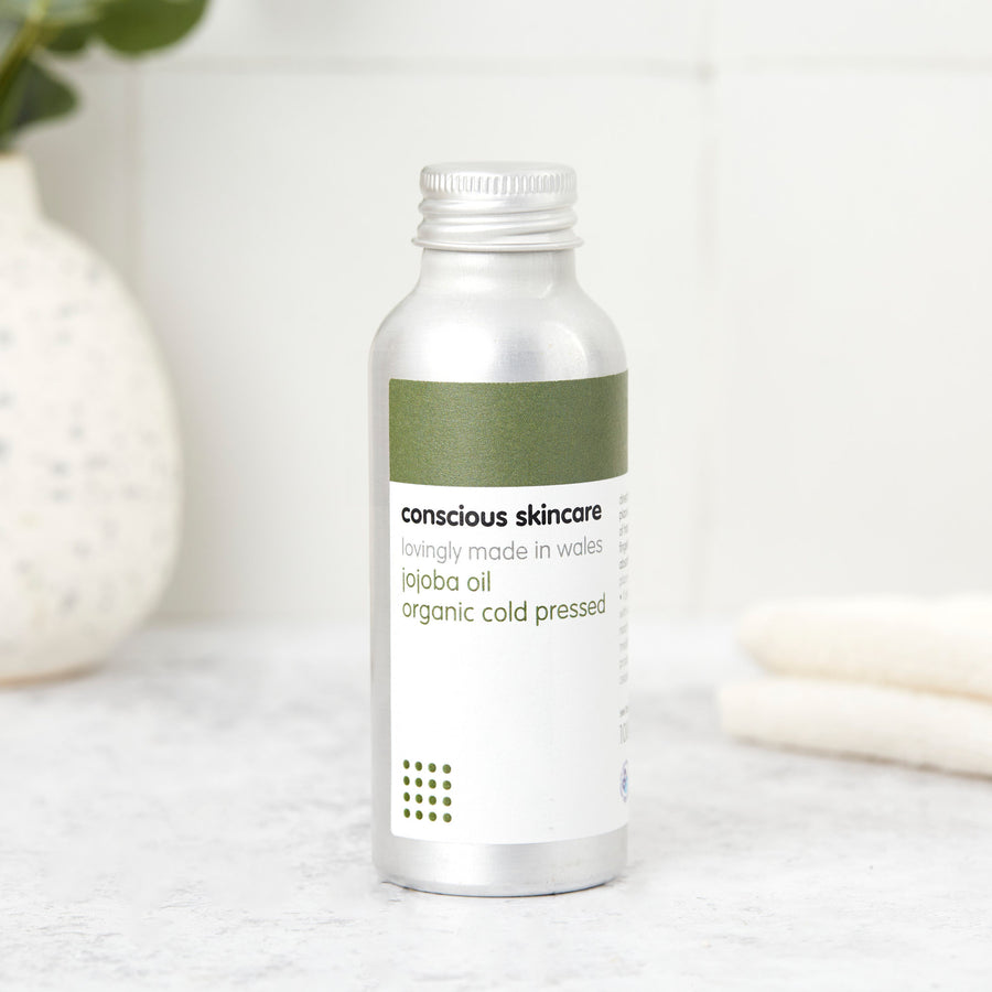 organic cold-pressed jojoba oil for skin in a 100ml aluminium bottle; lightweight face, body & hair oil